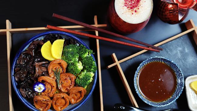 Braised abalone with imported mushrooms and steamed broccoli.