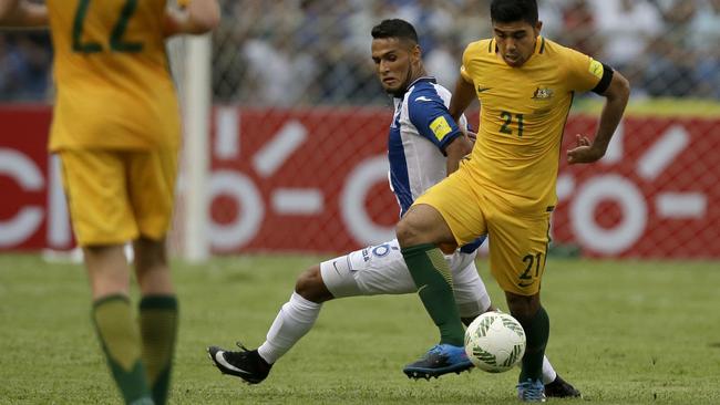 Australia's Massimo Luongo fights for the ball with Honduras' Alexander Lopez. Picture: AP