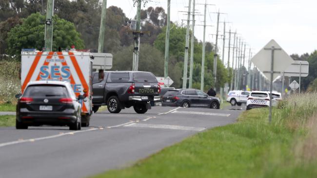 Authorities block off a road at Ardmona where police have shot dead fugitive Stan Turvey. Picture: David Crosling