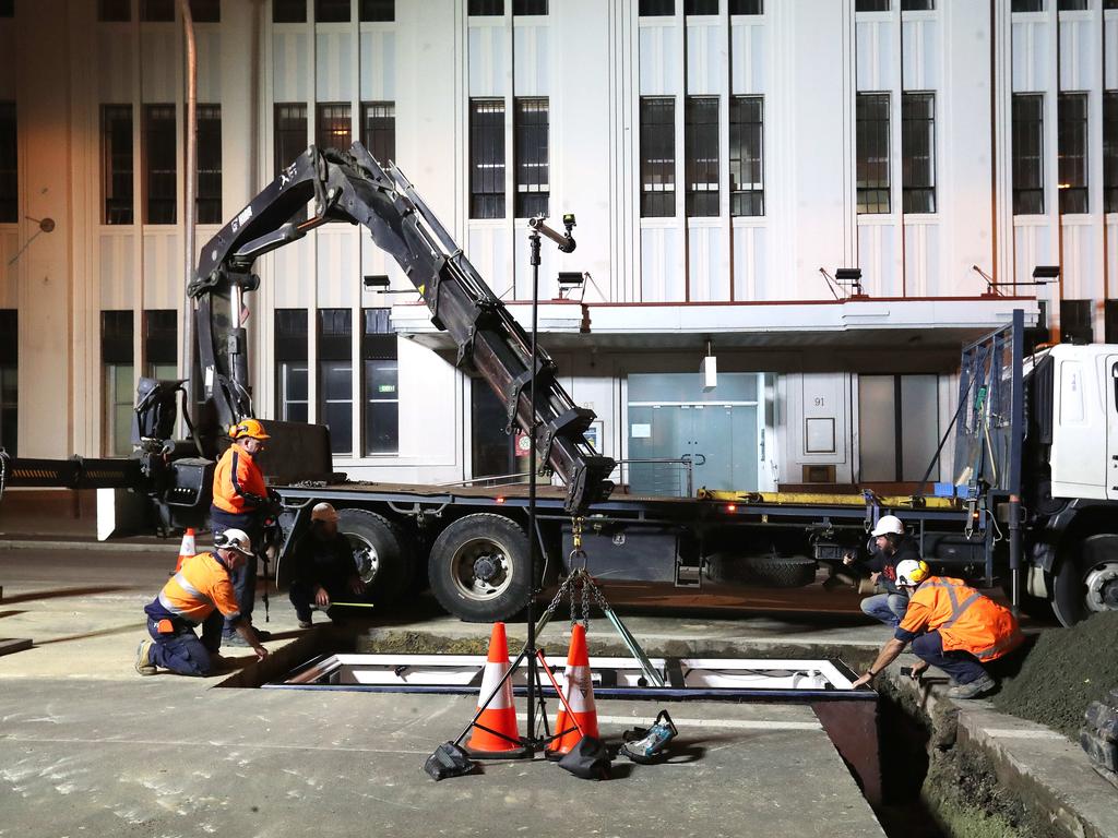 Work in Macquarie Street Hobart on the hole that will house the chamber performance artist Mike Parr will live in for 72 hours during Dark MOFO. Picture: NIKKI DAVIS-JONES