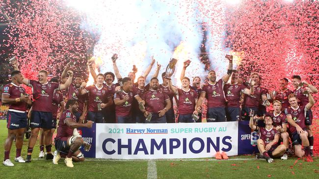 The Reds celebrate with the trophy. Picture: Jono Searle/Getty