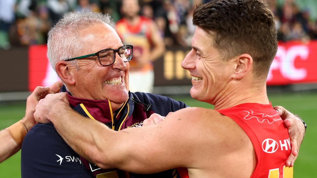 Chris Fagan and Dayne Zorko celebrate last week’s MCG win over Hawthorn. Picture: Josh Chadwick/AFL Photos/via Getty Images