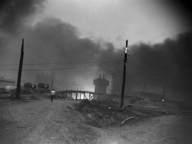 Mercury Historical Archive image. 1967 ( nineteen sixty seven ) Hobart bushfire ( bush fire ). 7 February 1967. Historical / Hobart / Mercury / film scan. G5122/11 Published Black Tuesday 50th Anniversary Part Two "Channel and Huon" page 5The carbide factory at Electrona resembled a war zone and was  still on fire when the Mercury’s photographer captured this image.