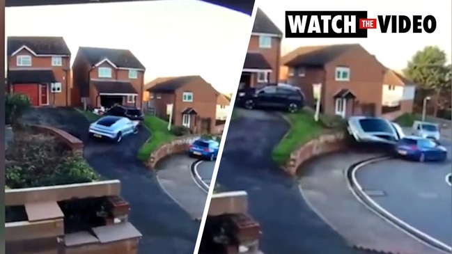 Worst parking fail ever as Porsche drives over wall and onto another car