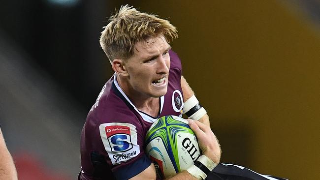 Reds halfback Tate McDermott is tackled. Picture: AAP 