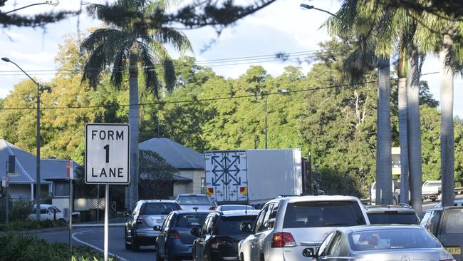 FILE PHOTO: Motorists merge into one lane.