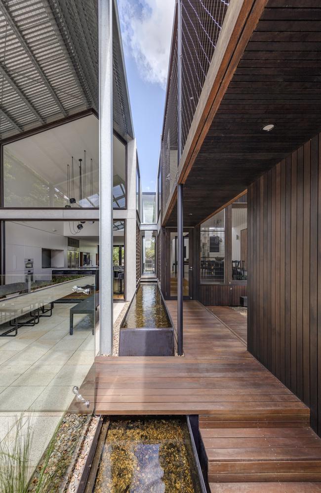 Another open walkway and fishpond connects space on the ground floor.