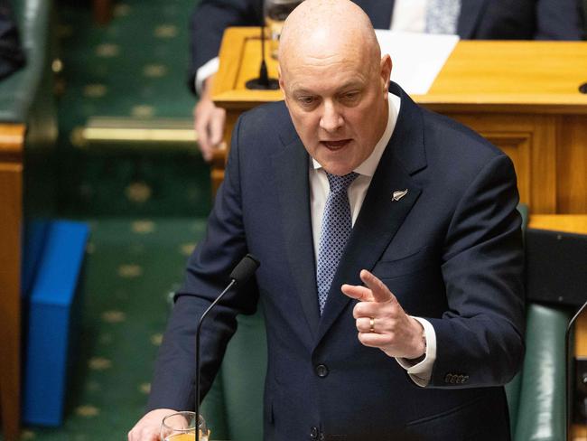 New Zealand's Prime Minister Christopher Luxon speaks in the debating chamber as Parliament holds its first session following the October 14 general election, in Wellington on December 6, 2023. (Photo by Marty MELVILLE / AFP)