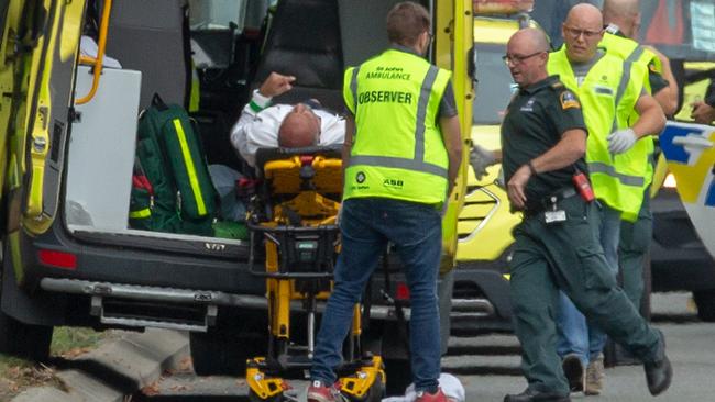 An injured person is loaded in an ambulance following a shooting at the Masjid Al Noor mosque in Christchurch. Picture: AAP