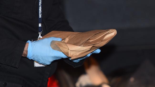 An item believed to be a handgun in an evidence bag. Picture: Nicole Garmston