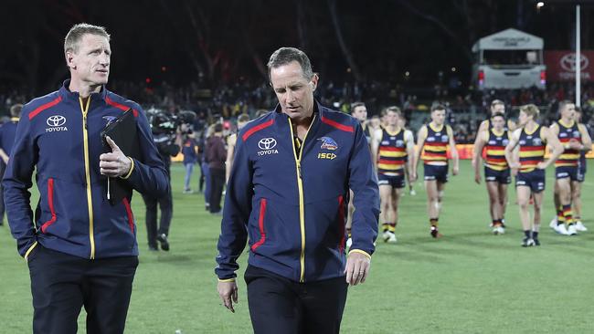 Brett Burton and Don Pyke leave Adelaide Oval after a loss. Picture SARAH REED