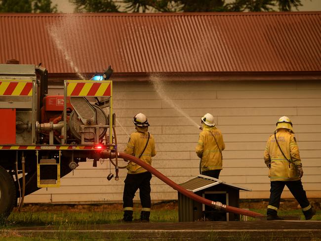 NSW Rural Fire Service crews protect property as the Gospers Mountain fire approaches Bilpin. Picture: AAP/Dan Himbrechts