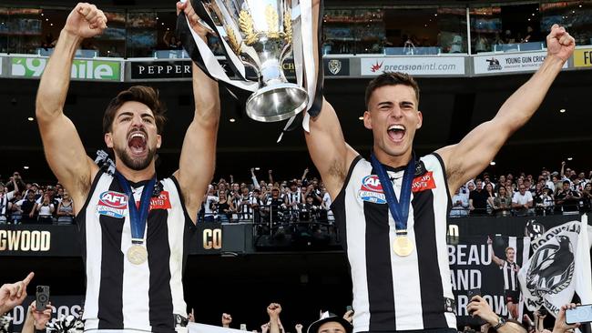 MELBOURNE , AUSTRALIA. September 30, 2023. AFL Grand Final between Collingwood and the Brisbane Lions at the MCG.  Josh Daicos and Nick Daicos of the Magpies with the cup celebrating   .Picture by Michael Klein