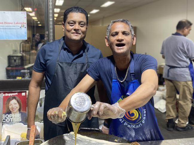 Owner of the murtabak chicken stall Rahamat Ullah (pictured left) at the Ramadan Night Markets. Picture: Kirsten Jelinek.