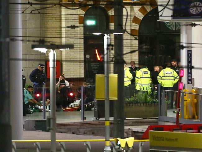 Members of the public receive treatment from emergency service staff at Victoria Railway Station close to the Manchester Arena. Picture: Dave Thompson/Getty Images