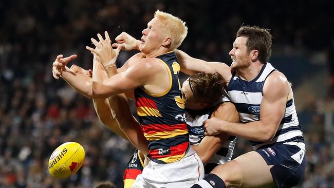 Elliott Himmelberg of the Crows contests a mark with Rhys Stanley and Patrick Dangerfield of the Cats in round 15. Picture: Michael Willson/Getty Images