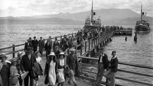 Employees and families from Tasmania’s Cadbury-Fry-Pascall factory disembarking from the river steamer ferries Excella and Cartela for their annual picnic day at South Arm. 