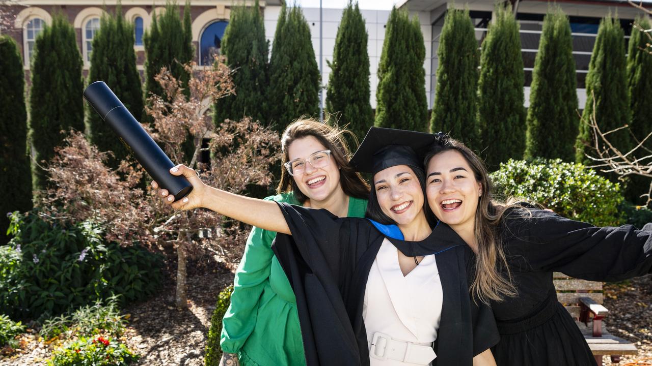 Master of Science graduate Aline dos Passos Silva with friends Luiza Sartori (left) and Marcela Reis at her UniSQ graduation ceremony at Empire Theatres, Wednesday, June 28, 2023. Picture: Kevin Farmer