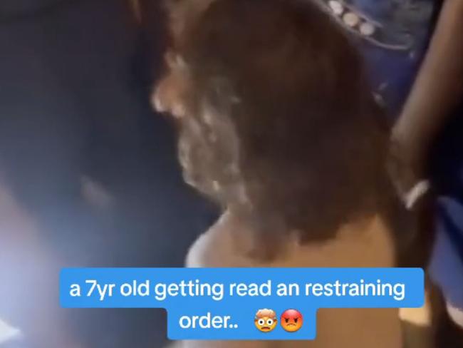 A TikTok video shows police serving a seven-year-old boy with a violence restraining order. Picture: Tiktok,