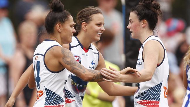 Cyril Rioli’s cousin Danielle Ponter (centre) celebrates a goal against the Roos. Picture: AAP