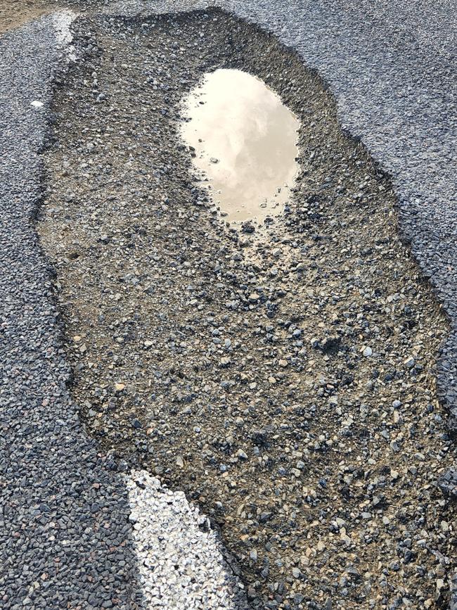 A pothole on the Bruce Highway near Bajool on August 14. Photos Darryn Nufer.