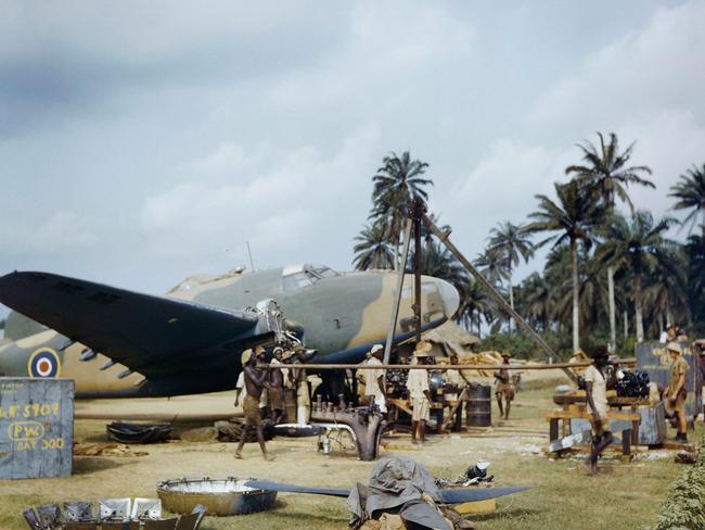 Local workers helping RAF fitters change the engine of a Lockheed Hudson at Yundum in the Gambia, April 1943. Picture: Imperial War Museum