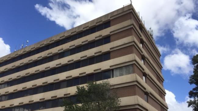 Bricks from a fouth floor balcony facade tumbled to the ground after severe weather on Monday, prompting a safety audit.