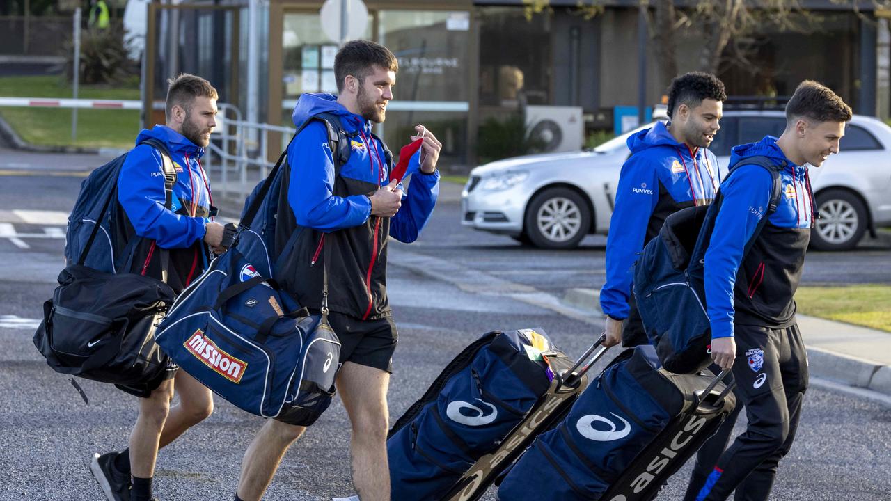 Western Bulldogs players arrive at Melbourne Jet Base to take a charter flight to Queensland. Picture: David Geraghty