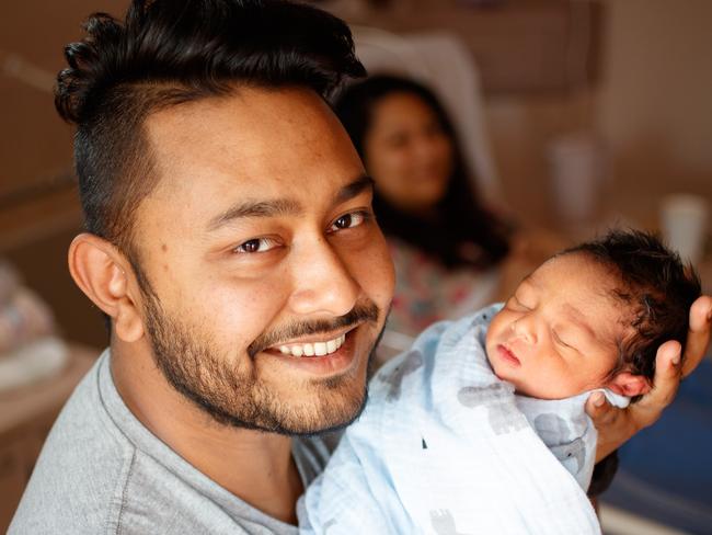 14/5/18 Raj Sarfarraz with his 2 day old son Zoraiz and wife Kashfee Ahmed (background) at the Women's and Children's Hospital Picture MATT TURNER.