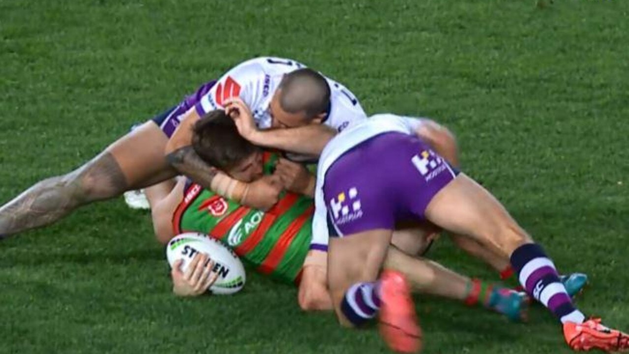 Nelson Asofa-Solomona performs a crusher tackle on the Rabbitohs’ Dean Britt.