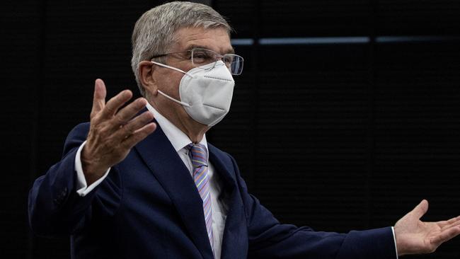 International Olympic Committee (IOC) president Thomas Bach gestures as he arrives at a meeting with Tokyo 2020 president Seiko Hashimoto (not pictured) at the Tokyo 2020 headquarters in Tokyo on July 13, 2021. (Photo by Takashi Aoyama / POOL / AFP)