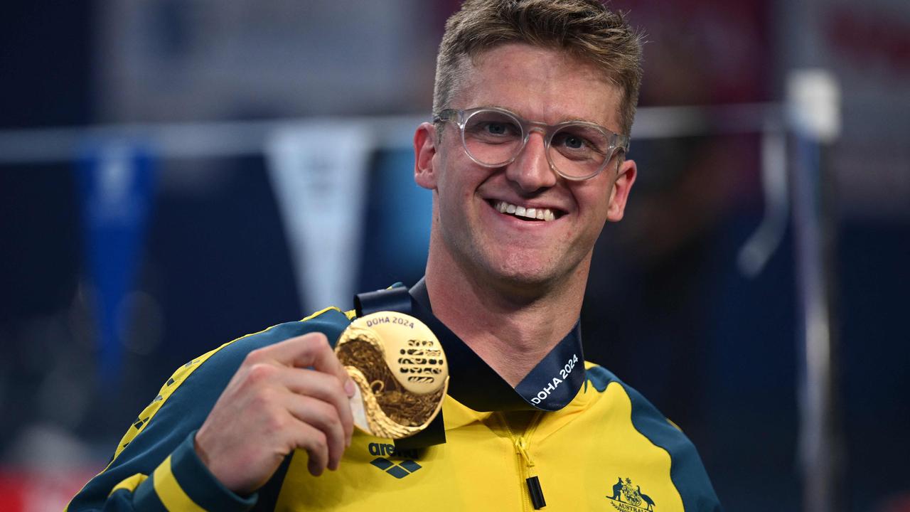 Australia's Sam Williamson poses with his gold medal (Photo by Oli SCARFF / AFP)