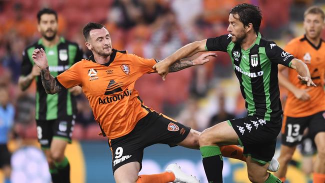 Brisbane Roar’s Roy O’Donovan (left) and Western United’s Dario Jertec collide on Friday night. Picture: Getty Images