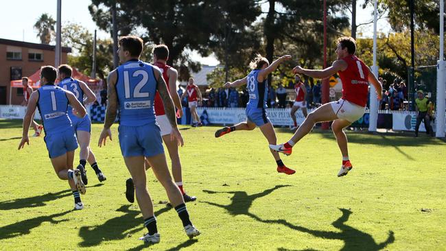 North’s Aidan Tropiano kicks clear at Prospect Oval. Picture: AAP/Emma Brasier