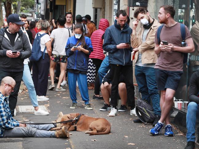 23/3/20: People line up at Centrelink in Surry Hills. Sydney is is shutdown to control the spread of the Corona virus after the PM Scott Morrison ordered the shutdown of cafes, pubs and many other non- essential services. John Feder/The Australian.