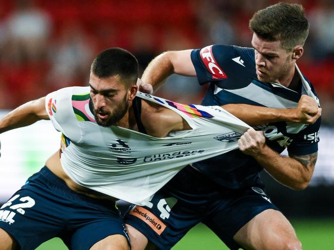 ADELAIDE, AUSTRALIA - MARCH 09:  Austin Ayoubi of Adelaide United   competes with  Connor Chapman of the Victory during the A-League Men round 20 match between Adelaide United and Melbourne Victory at Coopers Stadium, on March 09, 2024, in Adelaide, Australia. (Photo by Mark Brake/Getty Images)