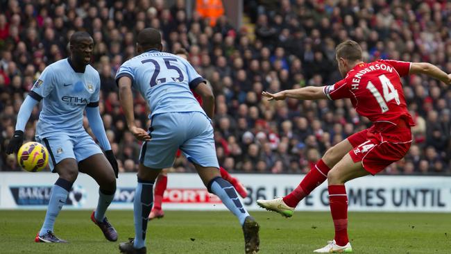 Liverpool's Jordan Henderson, right, unleashes his scoring shot.