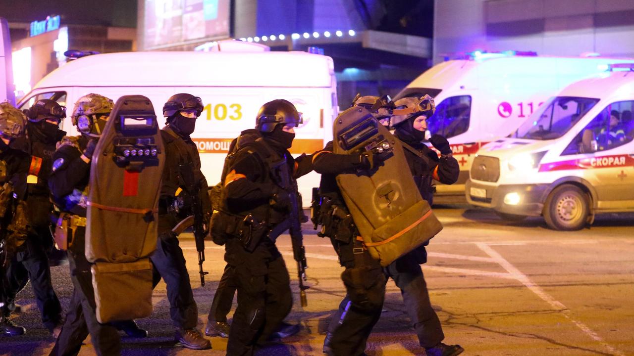 Special forces prepare to enter the building following the attack on Friday. Picture: AFP