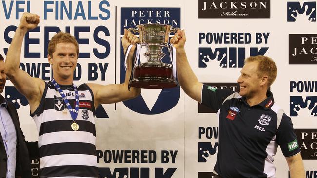 Port Melbourne vs Geelong at Etihad Stadium. Troy Selwood and Matthew Knights hold the cup aloft