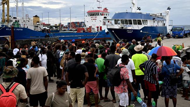 Solomon Islanders wait at Honiara port to board boats to reach their hometowns ahead of Wednesday’s general elections. Picture: AFP