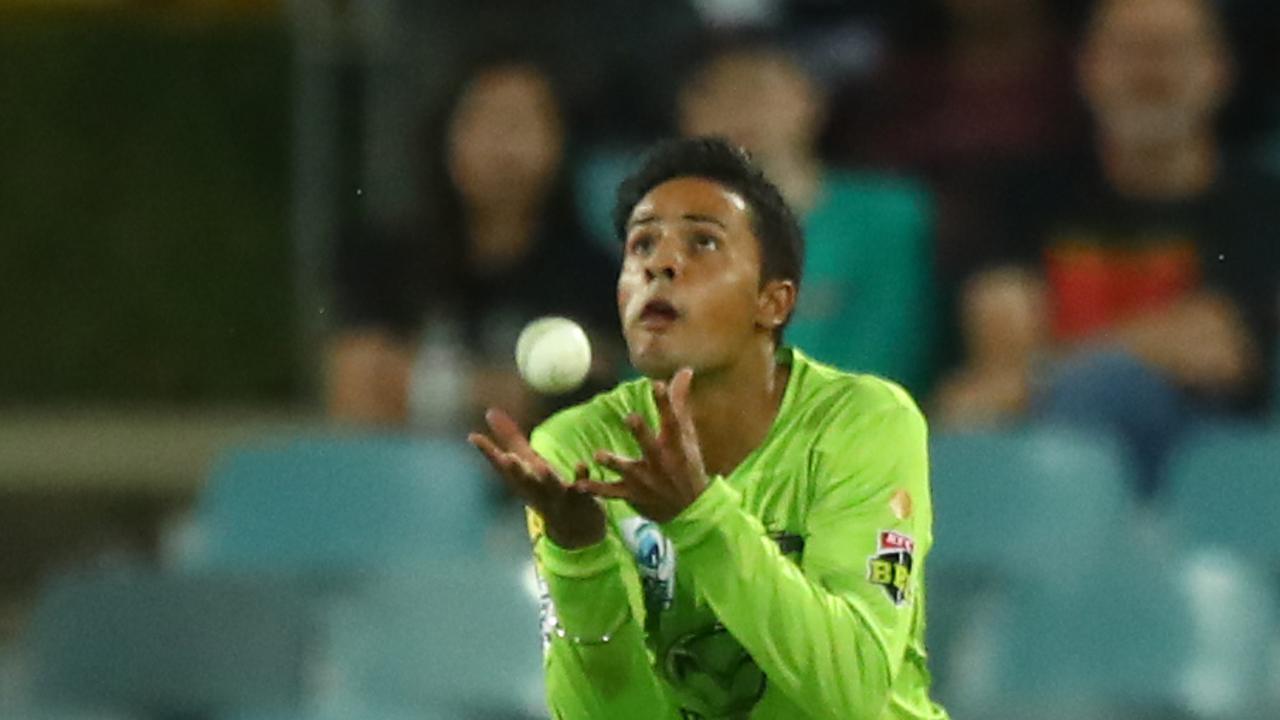 Tanveer Sangha catches out Imad Wasim of the Renegades during the Big Bash League match.