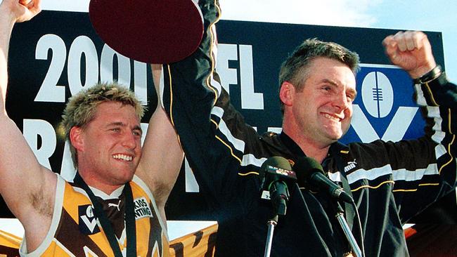 Donald McDonald holds Box Hill’s 2001 VFL premiership cup aloft Picture: Tom Campbell