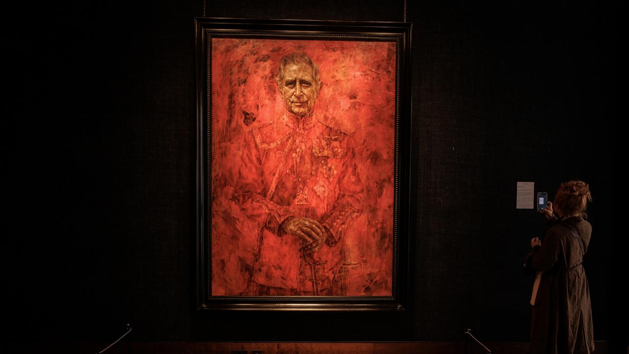 The portrait, created by artist Jonathan Yeo, was unveiled at the Philip Mould Gallery in London and was briefly defaced with the image of Wallace. Picture: Dan Kitwood/Getty Images