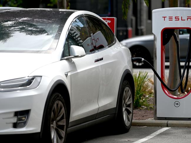 ADELAIDE, AUSTRALIA - NewsWire Photos October 20, 2022: Generic photos of electric cars and charging stations. Tesla charging station at the Franklin Street bus station.Debate over repeal of electric vehicle levy to continue/ conclude in SA lower house. The tax forces electric vehicle owners to pay a 2.5 cent per kilometre mileage charge on zero-emission vehicles in lieu of the fuel excise not being paid. Axing the tax was an election promise of LaborÃs Peter Malinauskas. Picture: NCA NewsWire / Naomi Jellicoe