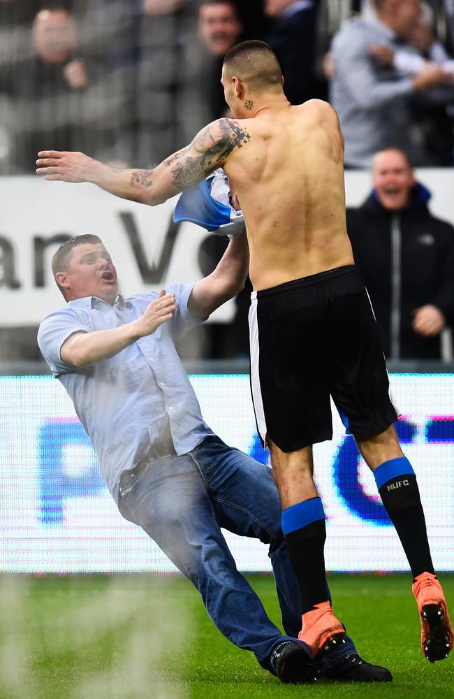 Aleksandar Mitrovic celebrates with a fan.