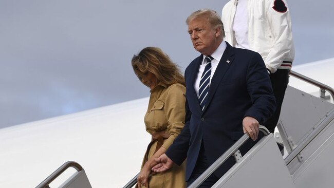 President Donald Trump and first lady Melania Trump walk down the steps of Air Force One at Andrews Air Force Base, Md., Sunday, Aug. 16, 2020. Trump was returning to Washington after spending the weekend at Trump National Golf Club in New Jersey. (Susan Walsh/AP)