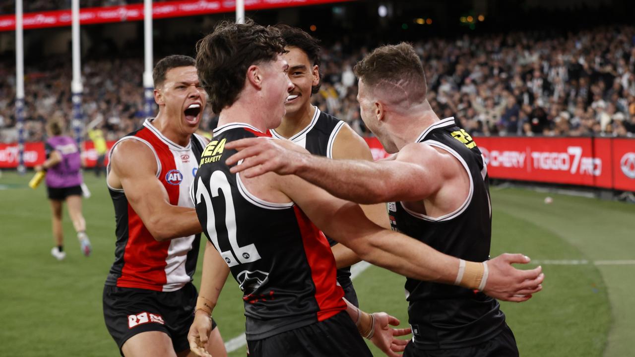 Saints players mob Higgins after the goal. (Photo by Darrian Traynor/Getty Images)