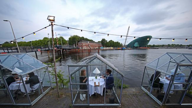 Diners at Mediamatic ETEN, a restaurant with so-called ‘quarantine greenhouses’ in Amsterdam, The Netherlands. Picture: Getty Images