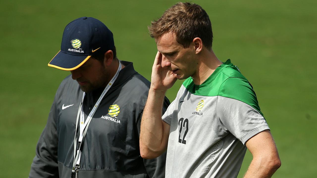 Peter Cklamovski (left) chats with Alex Wilkinson at Socceroos training. Picture: George Salpigtidis.