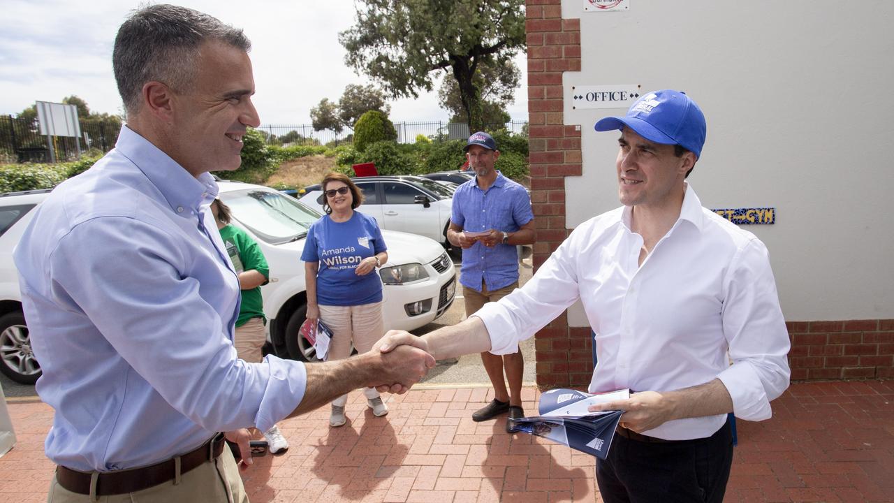 SA Liberal Leader Vincent Tarzia shakes hands with Premier Peter Malinauskas on by-election day at Woodend Primary School, Sheidow Park. Picture: Brett Hartwig